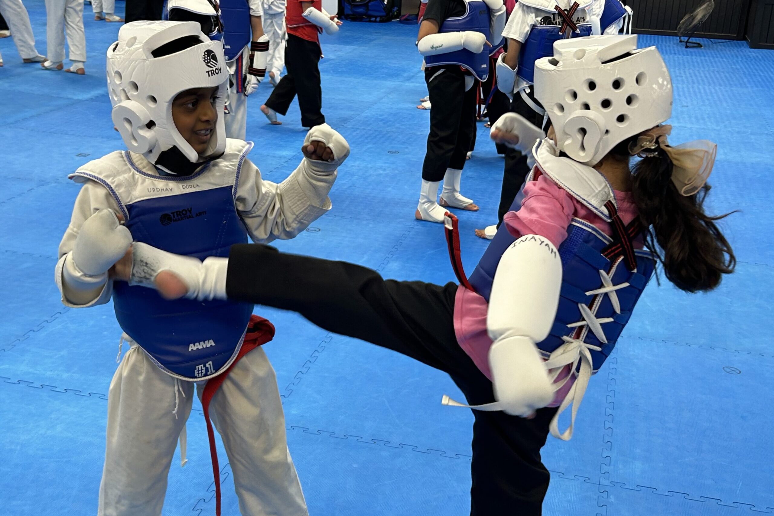 Taekwondo classes practicing sparring at Troy Martial Arts